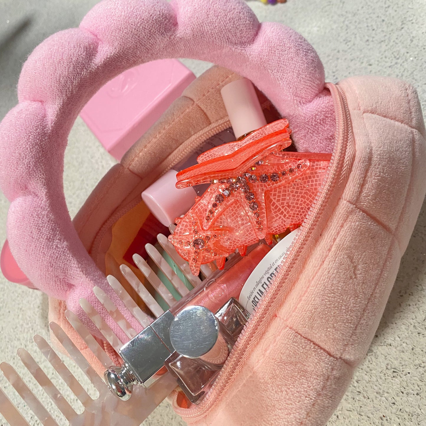 makeup bag with hair claw in pink